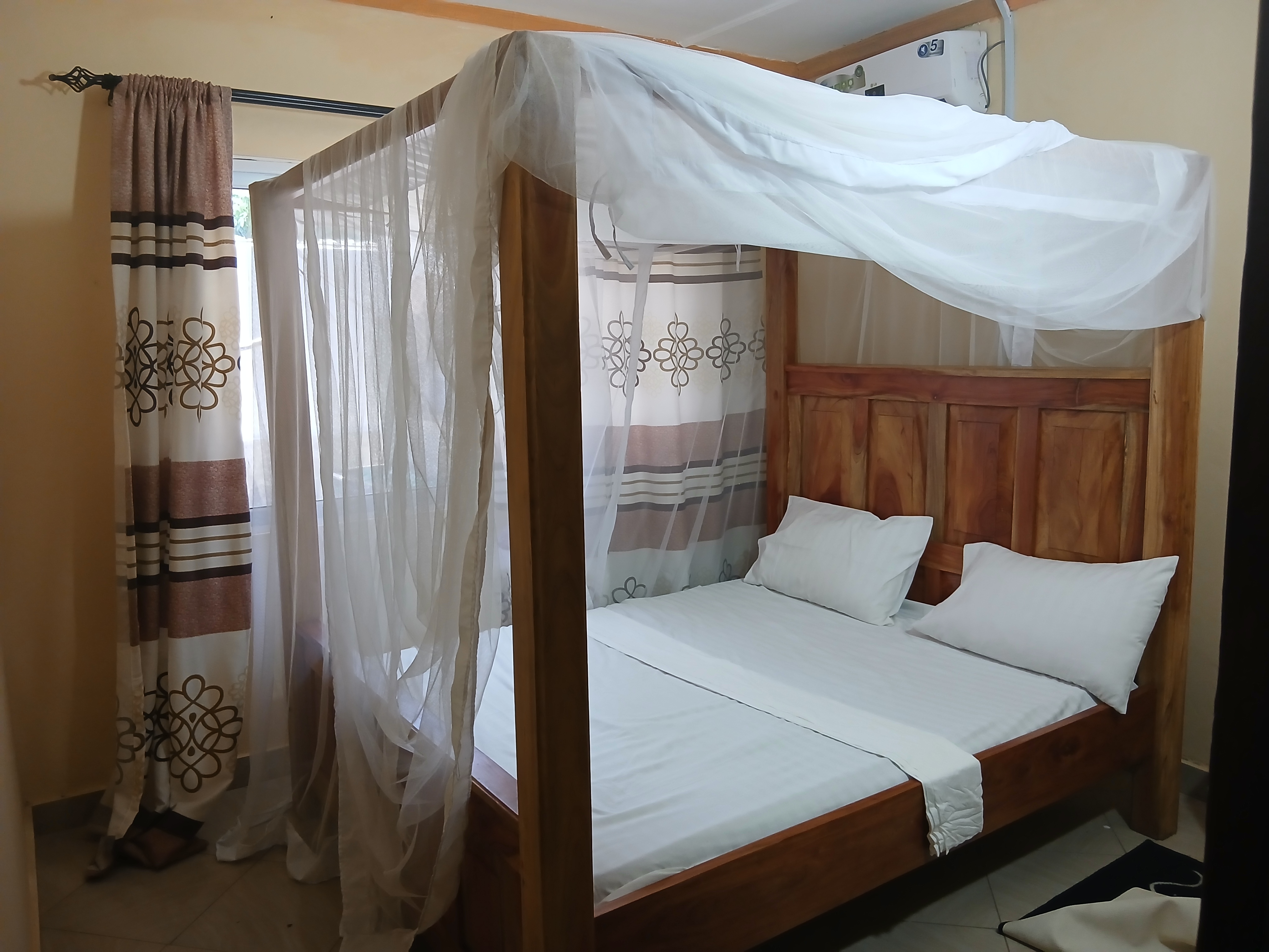Comfortable guest room at Magutu Villa Diani Beach
